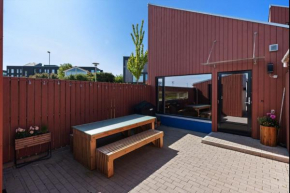 Terraced house with carport and sunny outdoor areas
